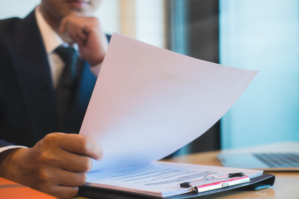 Businessman Reviewing Document in the Office