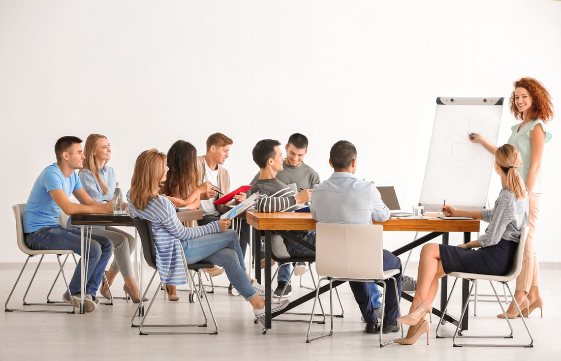 Group of People with Business Trainer at Seminar