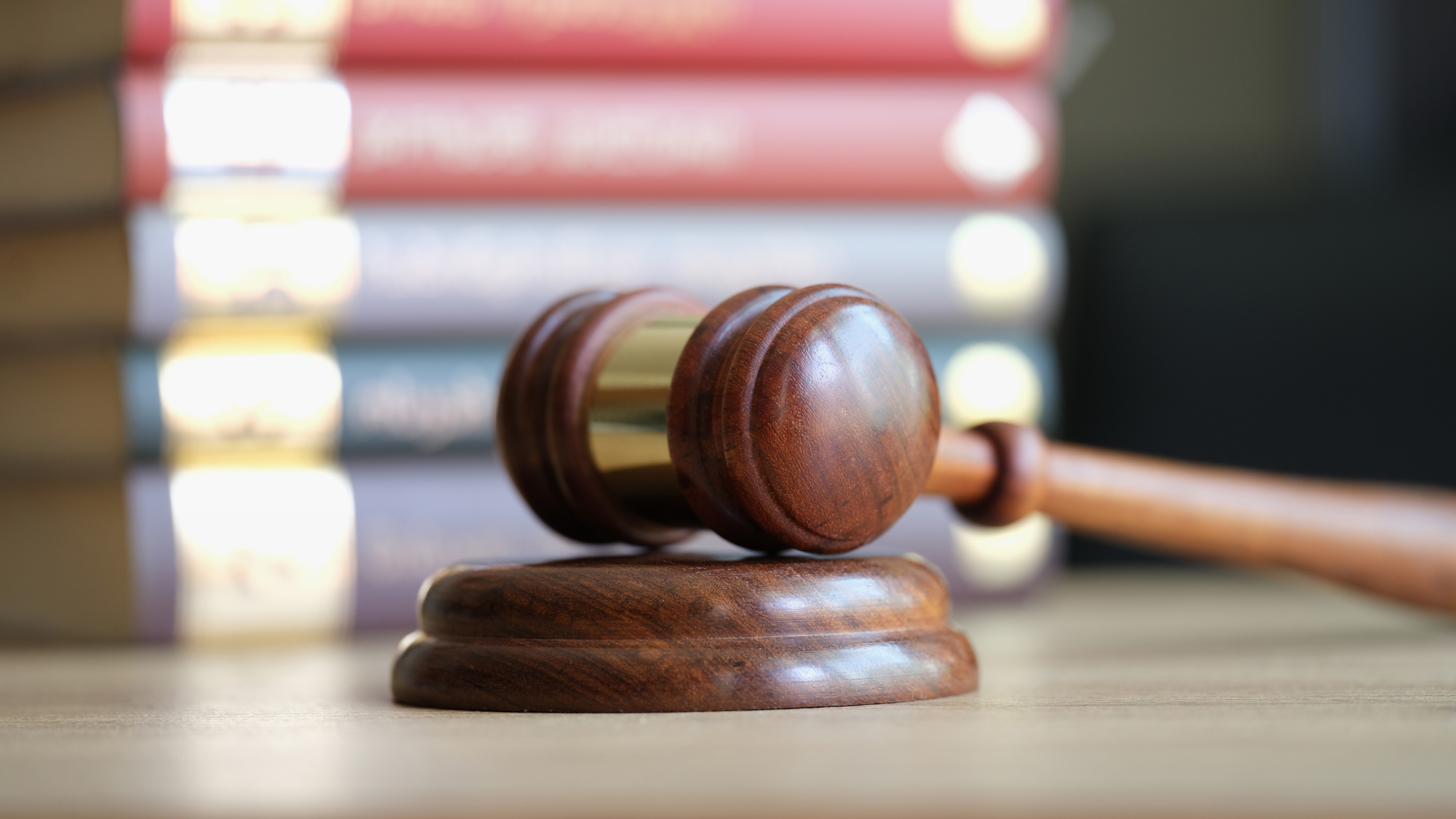 Judicial Gavel and Books in Courtroom Closeup