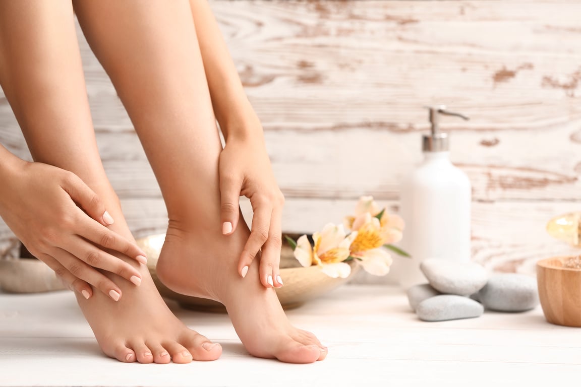 Young Woman after Spa Pedicure Treatment in Beauty Salon